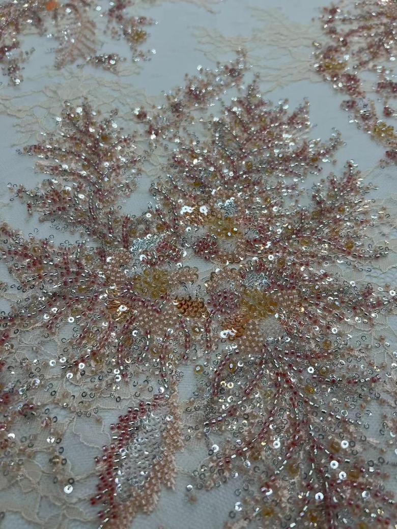 Hand-beaded floral embroidery on French chantilly lace