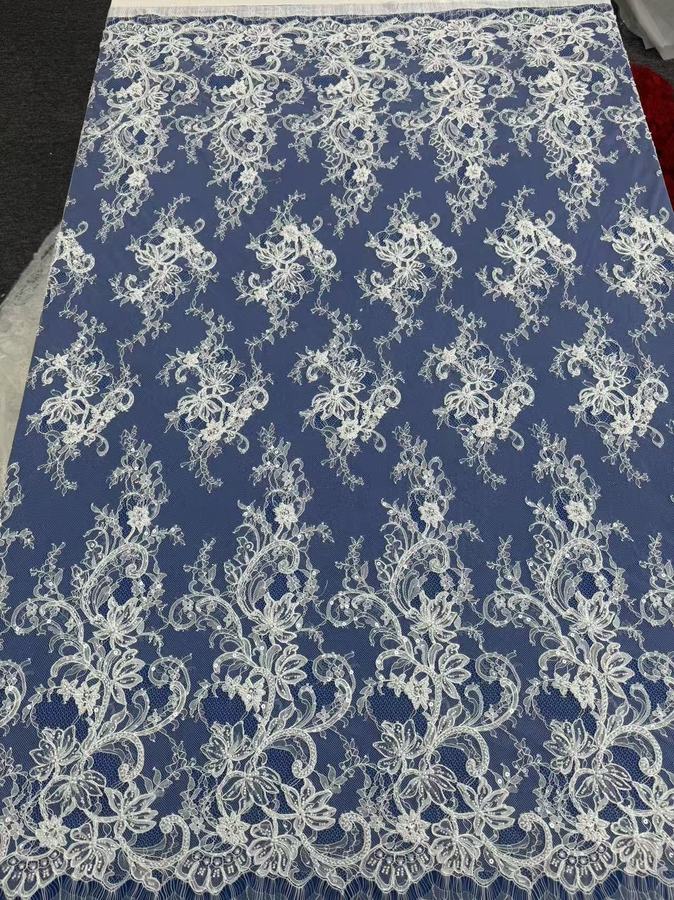 Sequin and stone embellished French lace, ivory on navy